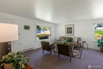 Living room, window blinds are on all windows.