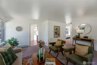 Living area leads to kitchen, 2 bedrooms and bathroom