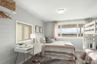 The second bedroom is spacious and also captures stunning sound views.