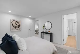 Primary bedroom with a beautifully updated en suite bath.