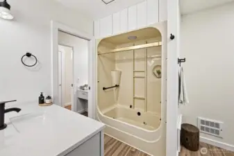 Large full bath with room on the right side of this photo for laundry machines!