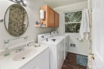 Full bathroom in the ADU with it's own laundry.