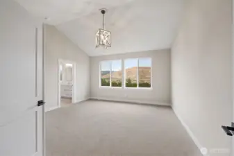 Enter double doors to the primary suite