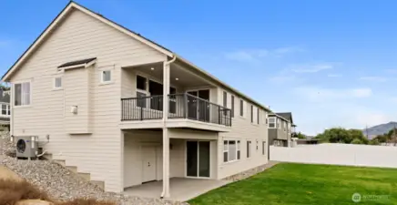 Viewing deck above, lower patio and HUGE storage room with power below.