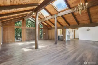 notice the exceptional lighting and wood plank ceiling. This area is for the Kitchen, and just off the kitchen you will see chandelier and dinning area