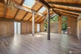 Notice the front door, with large windows to enjoy the natural setting or the outdoors and natural lighting