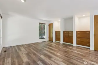 Master Bedroom #1 with built in drawers. You are able to see the front and back of home as the room is very large,  Windows to view the lovely landscape of the property. and nostalgic beauty of the aged timber and and natures beauty.