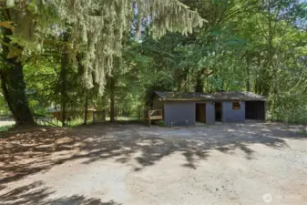 Outdoor shops next to the garage- to the left of this building, look closely to the woods on the left, notice the horse stalls in proximity....the gate to the left will take you to the horse stalls. Such a beautiful property to admire.
