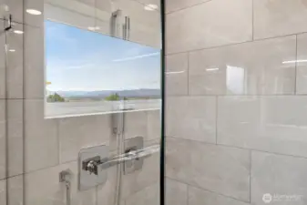 tiled shower with glass door