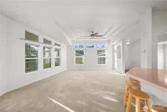 The open great room design blends the living and dining spaces, offering a bright and inviting layout perfect for gathering.