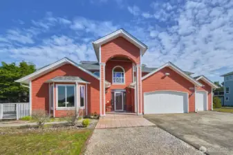 Welcoming covered entry with charming architectural accents.