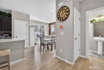 Welcoming entryway hallway with warm hardwood flooring and open sightlines