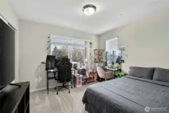 Well-appointed 3rd floor bedroom with ample closet space and bright, airy natural light