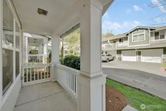 Welcoming front porch offers a peaceful spot to relax, framed by classic railings and clean architectural lines. Overlooking a well-kept neighborhood setting, this covered space provides a comfortable transition into the home while adding charming curb appeal.