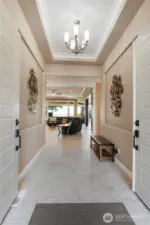 Enter through double doors into one level living featuring 9-11 foot ceilings, 2 ensuites + additional bedroom and theater/office room, heated floor, stunning views and open concept living