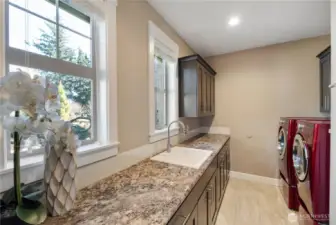 Large laundry with sink and storage