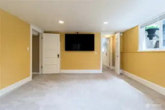 Downstairs Family or Media Room with wood burning fireplace