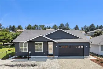 Great color scheme inside and out! Beautiful covered back patio. concrete aprons all around & back slope started with low maintenance decorative grasses.