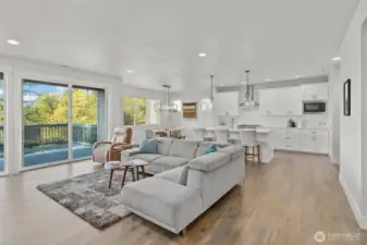 This bright, open-concept layout effortlessly connects the kitchen, dining, and living areas—ideal for entertaining or everyday comfort.