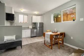 Open flow between dining area and kitchen.