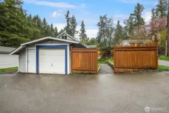 Single-car garage featuring gated entrance.