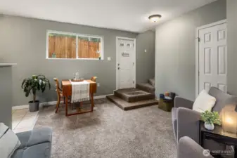 Living area with window providing ample natural light to flow throughout.