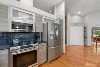 Stainless appliances and lovely backsplash compliment this beautifully updated kitchen.