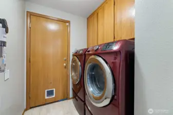 Utility room leads to the garage. Washer & dryer stay with the home.