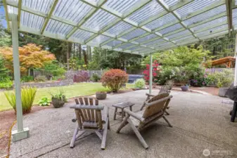 Enjoy your outdoors year round with this awesome covered patio! Look straight ahead to the right and see the new HOT TUB  that stays with the home!