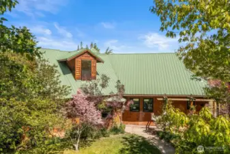 1581 Thomas Rd is out of a story book with privacy, mature landscaping, and careful details throughout.