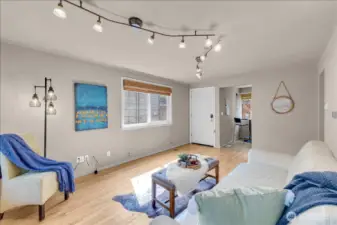 Enter to spacious living room with beauiful hardwood floors and lots of natural light