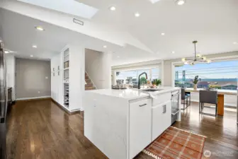 Tons of pantry space along this back wall. Look at those gorgeous floors!