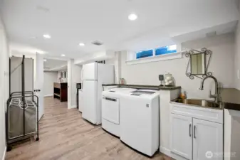 Large laundry room with a ton of storage space.