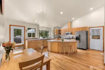 Open kitchen with island and plenty of cabinetry