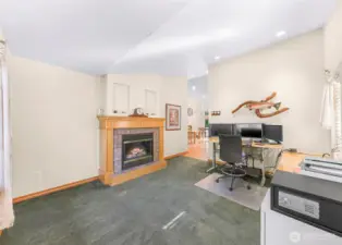 Formal living area featuring gas fireplace. (currently being used for home office)