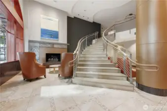 Gorgeous lobby with grand stairwell leads to private conference room & business area with computer & printer.