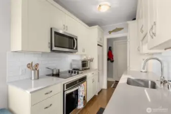 Kitchen with Stainless Steel Appliances, subway tile, quartz countertop
