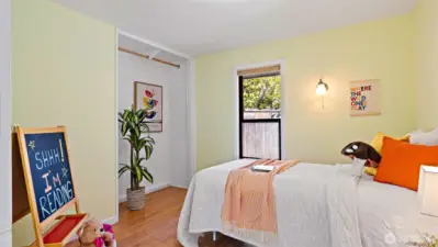 The second bedroom is painted a fresh spring green that feels sweet and refreshing. Will you make it a cozy guest room, a bright home office, or your favorite gaming spot?