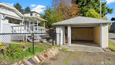 Here’s a great look at the four-foot black chain-link fence surrounding the backyard - it defines the space beautifully while keeping things open and bright. The entire property is fully fenced, perfect for gardening, pets, or simply enjoying a sense of peace outdoors.