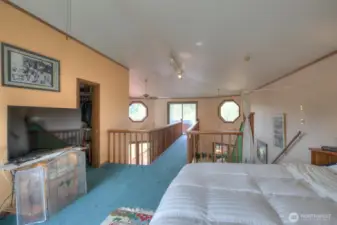 Primary bedroom, walk in closet, bathroom with soaker tub/shower, double vanity and a bridge (catwalk) leading to your large private deck with views of Conner Creek.