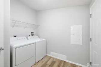 Good sized laundry room off kitchen and leads to garage. Washer and dryer stay.