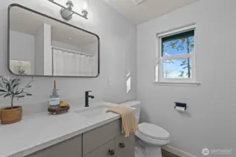 3/4 bathroom with added storage and a potential linen closet spot