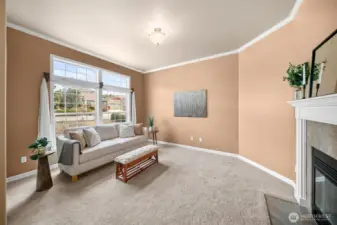 Formal Living room or Den with a wood burning fireplace!