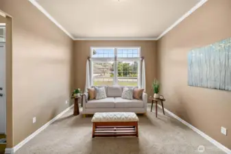 Beautiful formal dining room with views of the well kept neighborhood.
