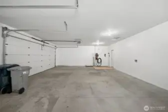 Large 3 car garage with ample space for all your toys and storage.