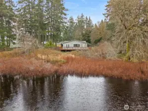 Enjoy stunning seasonal lake views, filled by winter and spring rains, offering a serene waterfront setting. During the drier summer months, the lakebed transforms into a natural open space, creating added privacy and a nature buffer