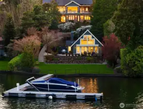 Positioned proudly on the north end of Mercer Island, discover a Modern Craftsman with an charming beachside guest house right at the water's edge.