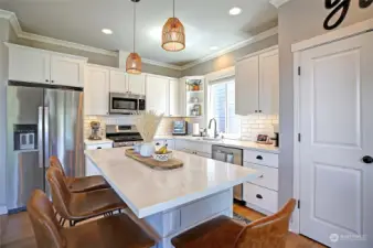 Gorgeous kitchen with smart lighting, below/above cabinet lighting, custom pullouts & SS appliances.