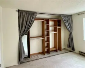 This closet is MUCH bigger than it looks in this photo.  Curtains were installed and doors were removed but doors and hardware have been kept so you can change back if you desire.