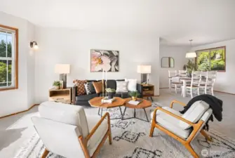 The formal living & dining rooms offer elegant spaces ideal for hosting dinner parties or holiday gatherings.